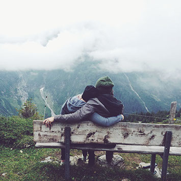 Couple sitting snuggled together enjoying the view